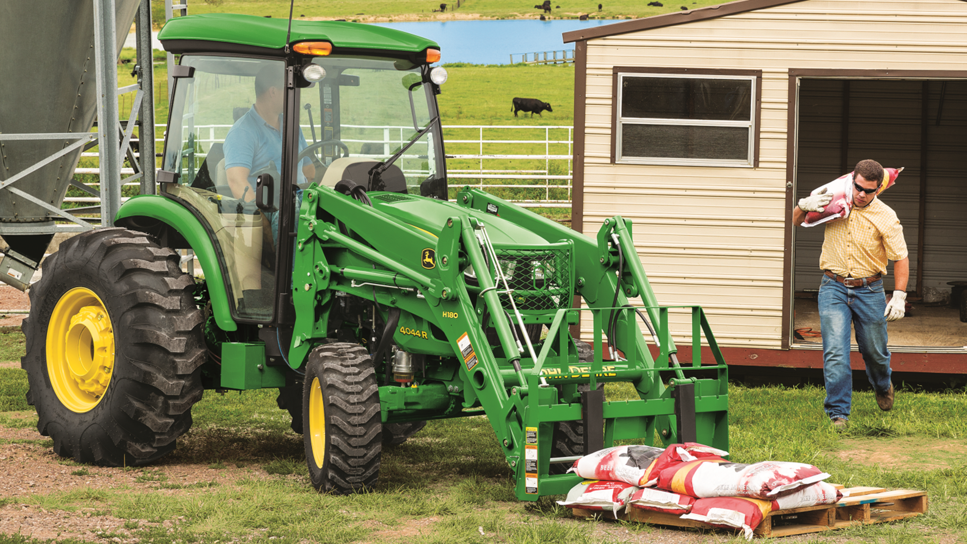 John Deere Compact Tractor with forks