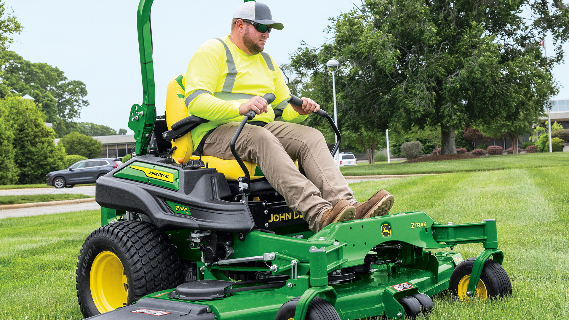 John Deere zero-turn mower cutting grass