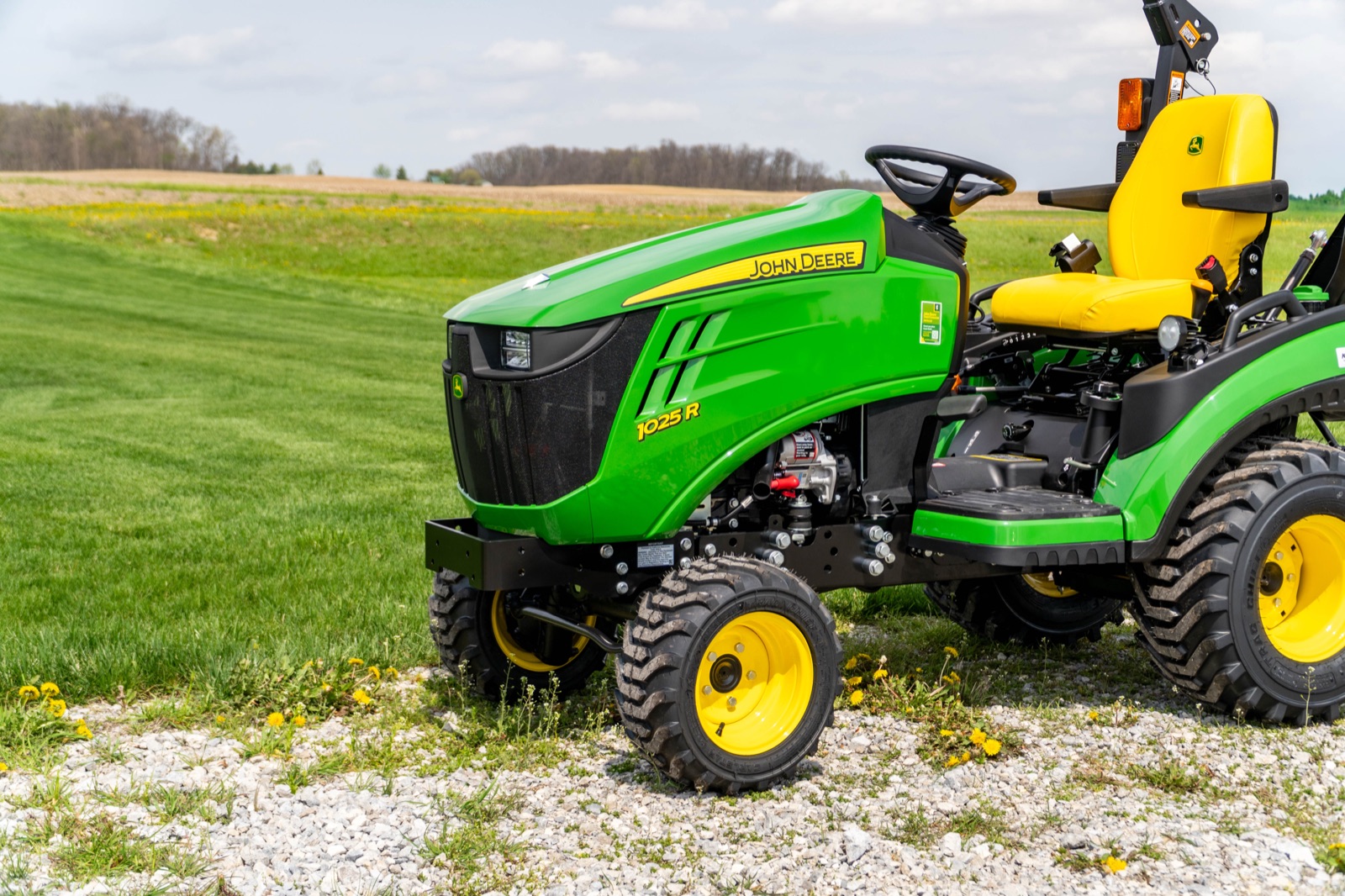Front view of a John Deere 1025R in the field