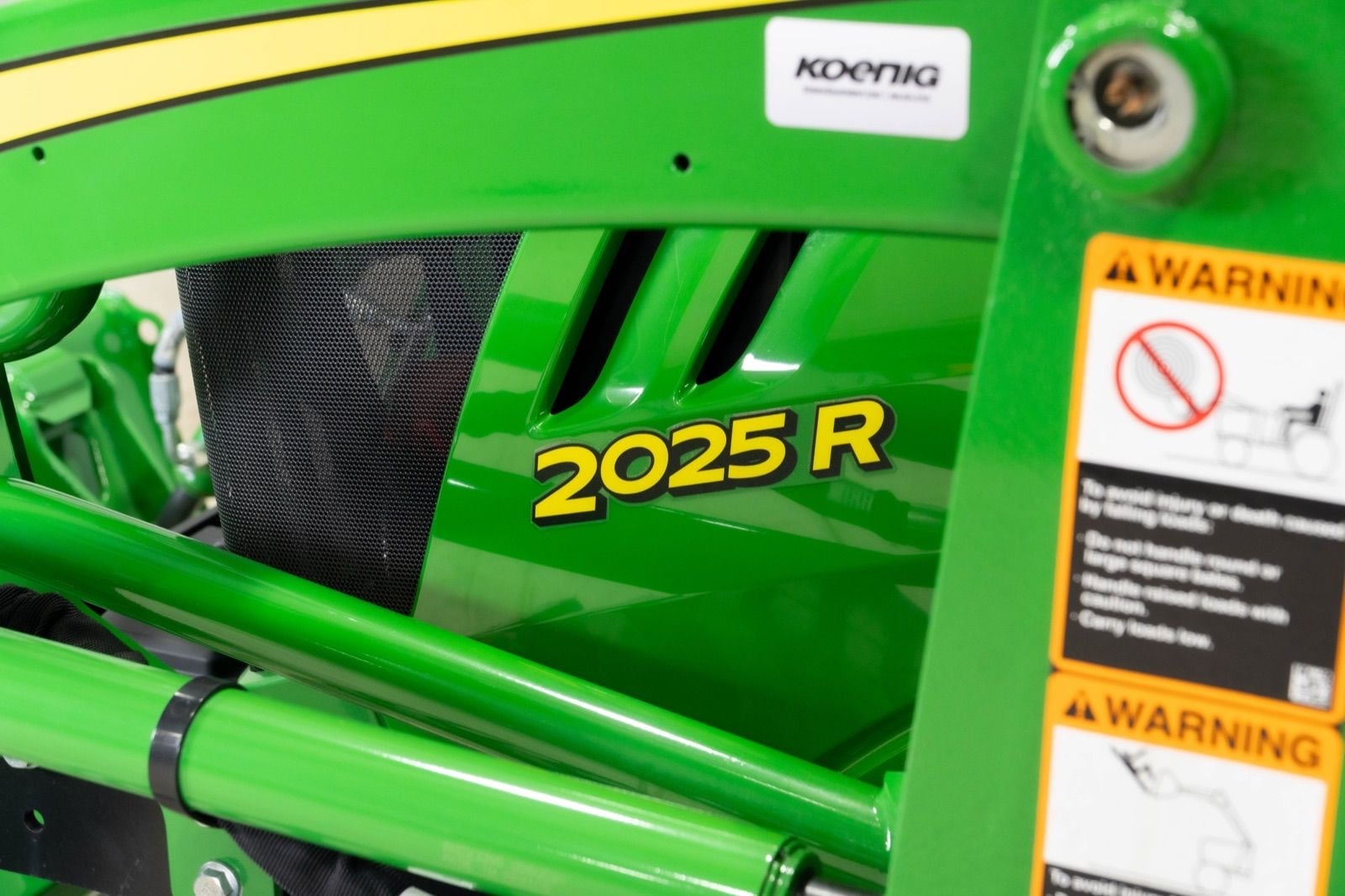2025R badge on a John Deere compact tractor