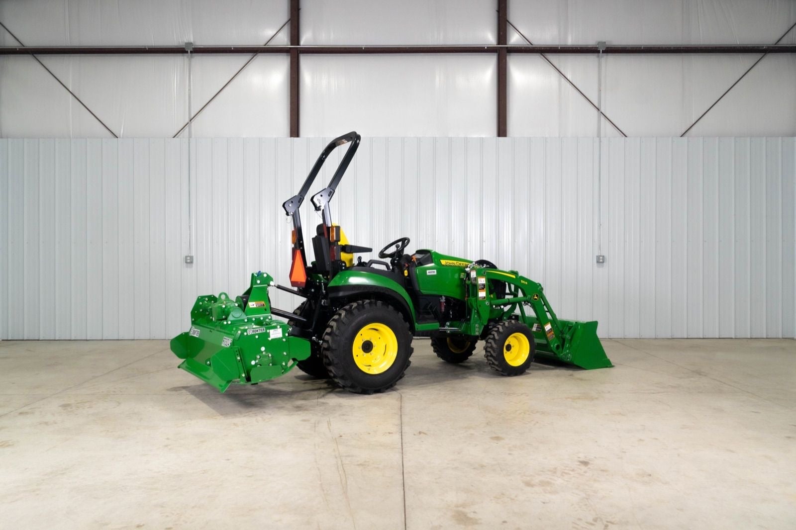 John Deere 2025R with an RT3049 tiller, rear three-quarter view