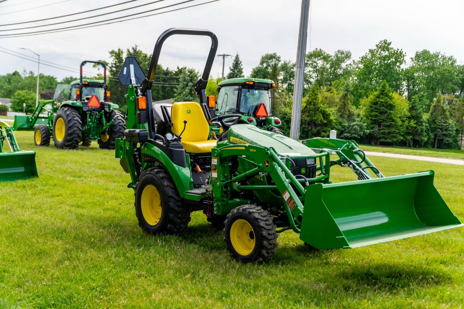 John Deere 2025R with a 120R loader, front view