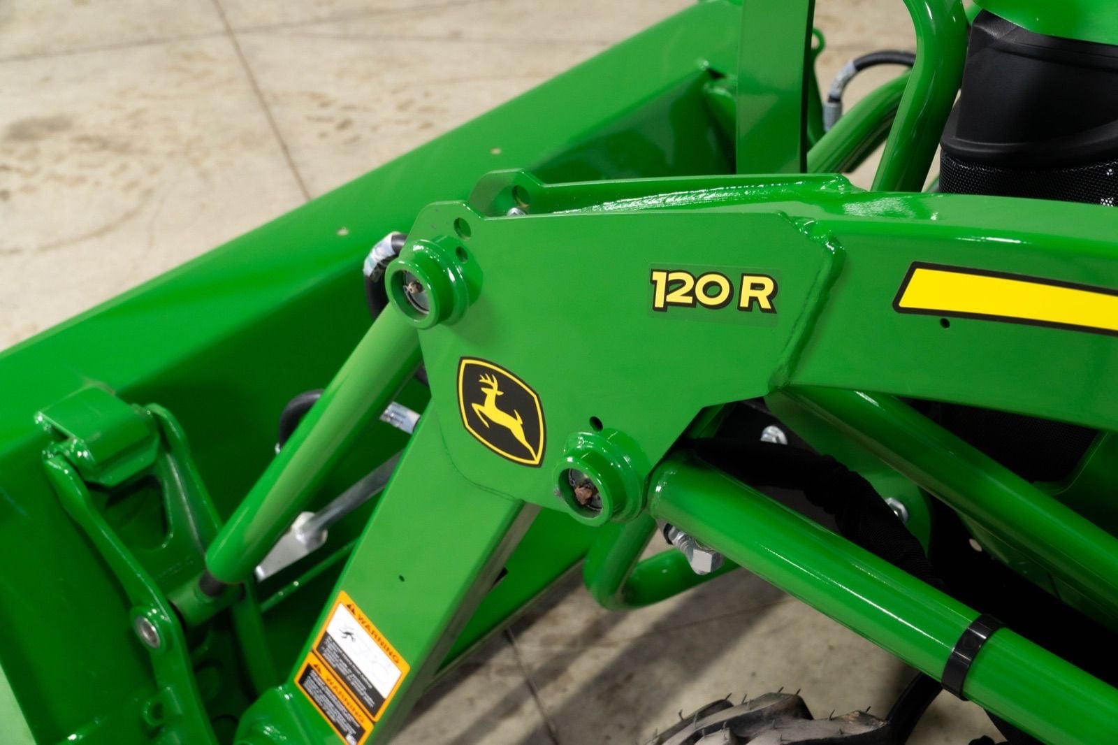 120R loader on a John Deere 2025R