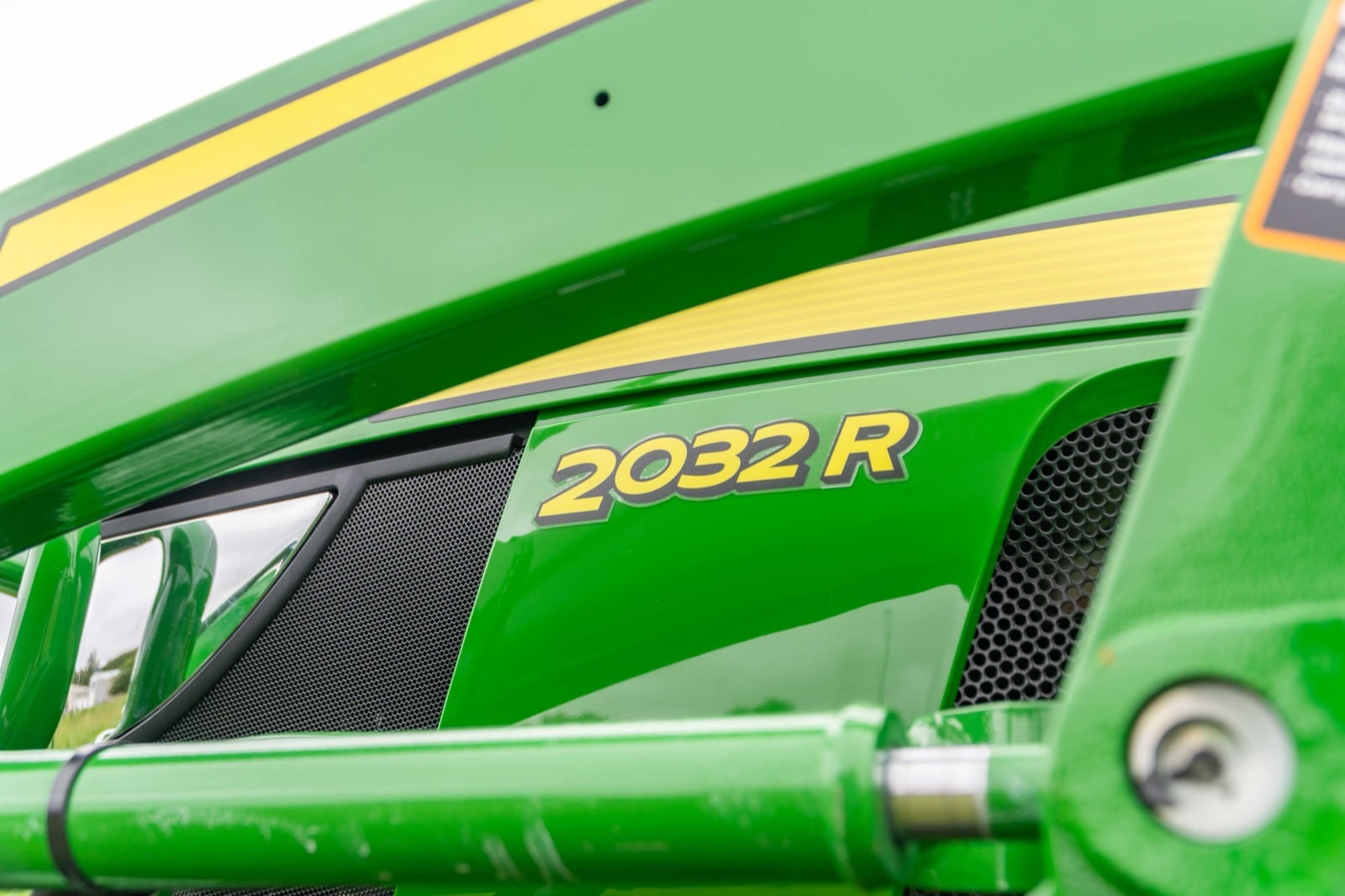 2032R badge on a John Deere compact tractor