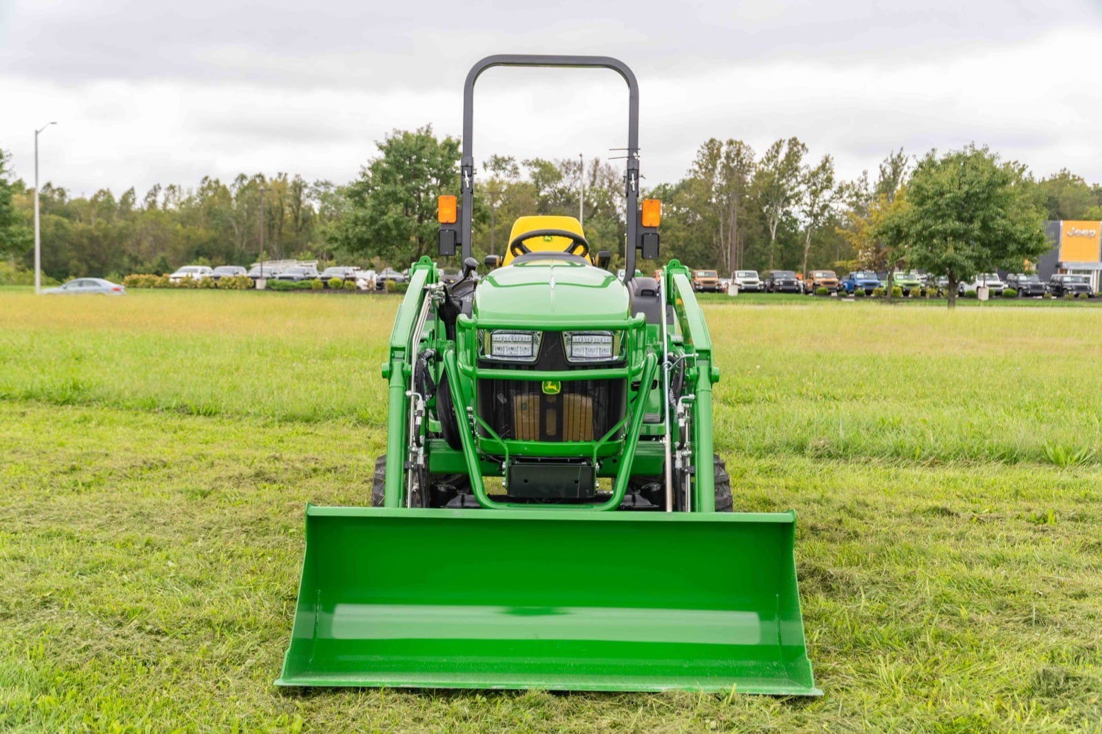 John Deere 2 Family tractor with a 220R loader, front view (2032R shown)
