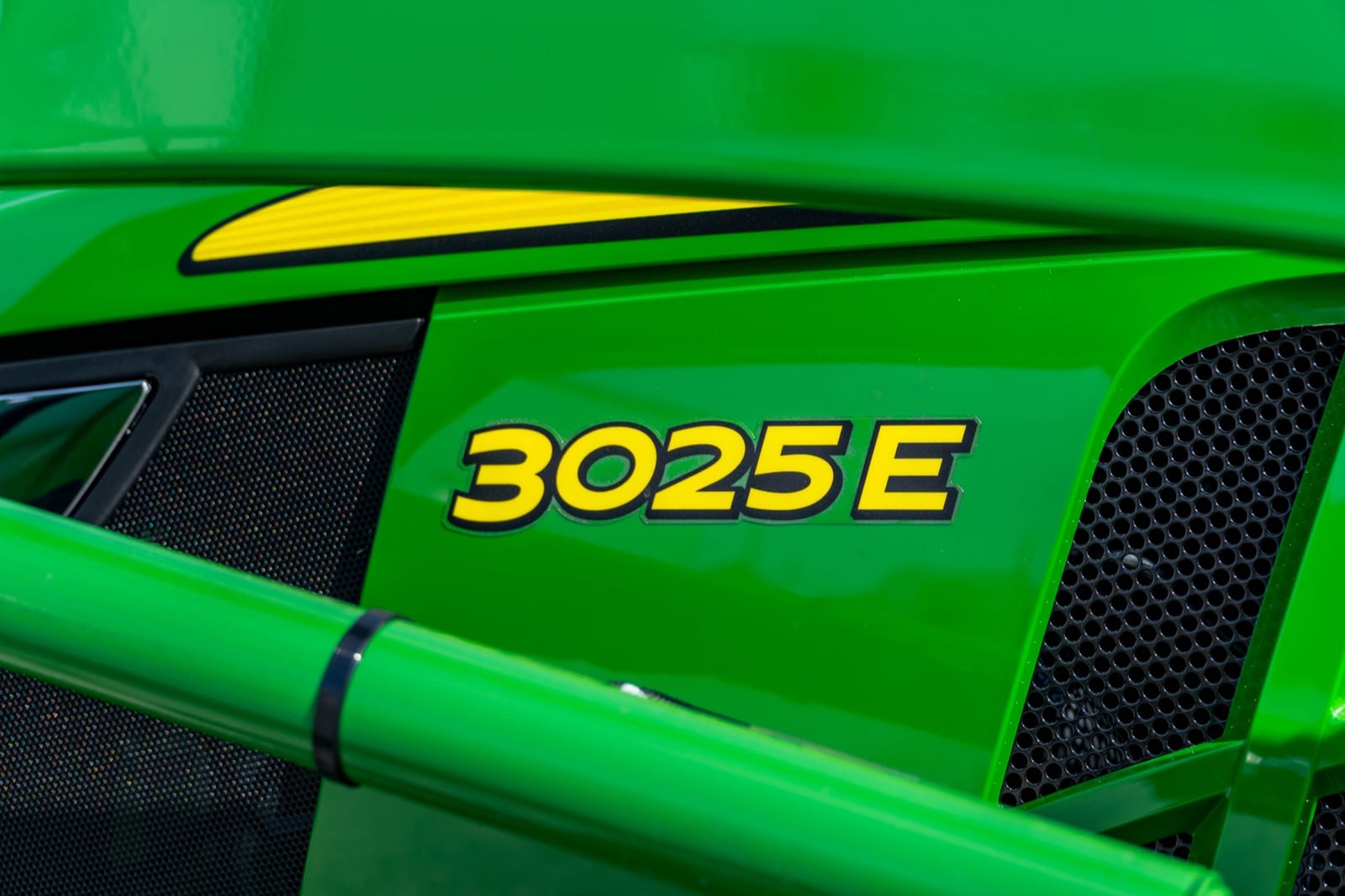 3025E badge on a John Deere compact tractor