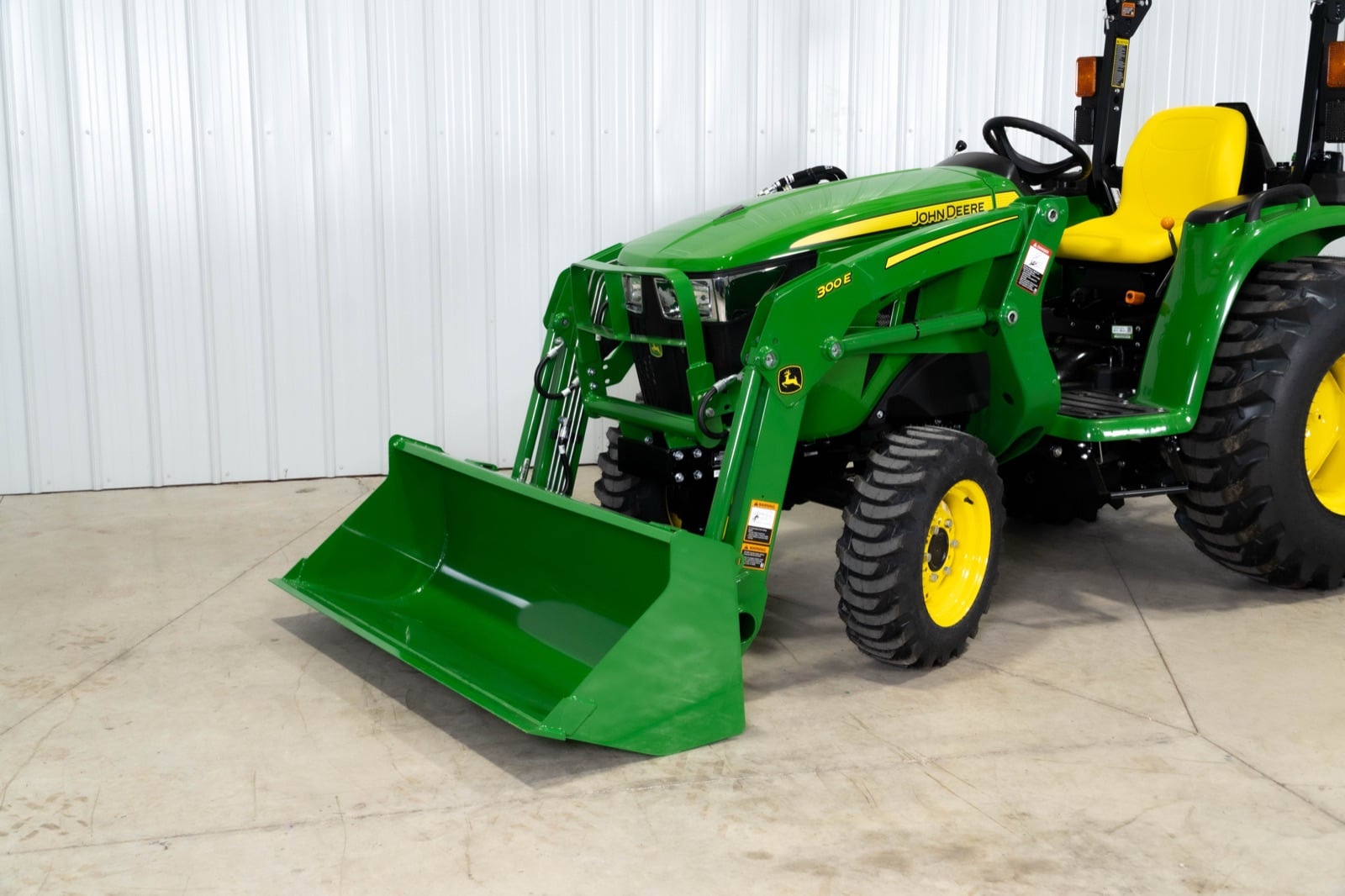 John Deere 3025E loader bucket close-up