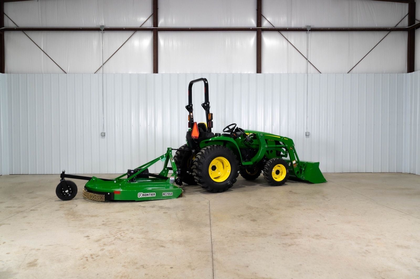 John Deere 3038E with a 300E loader, side view
