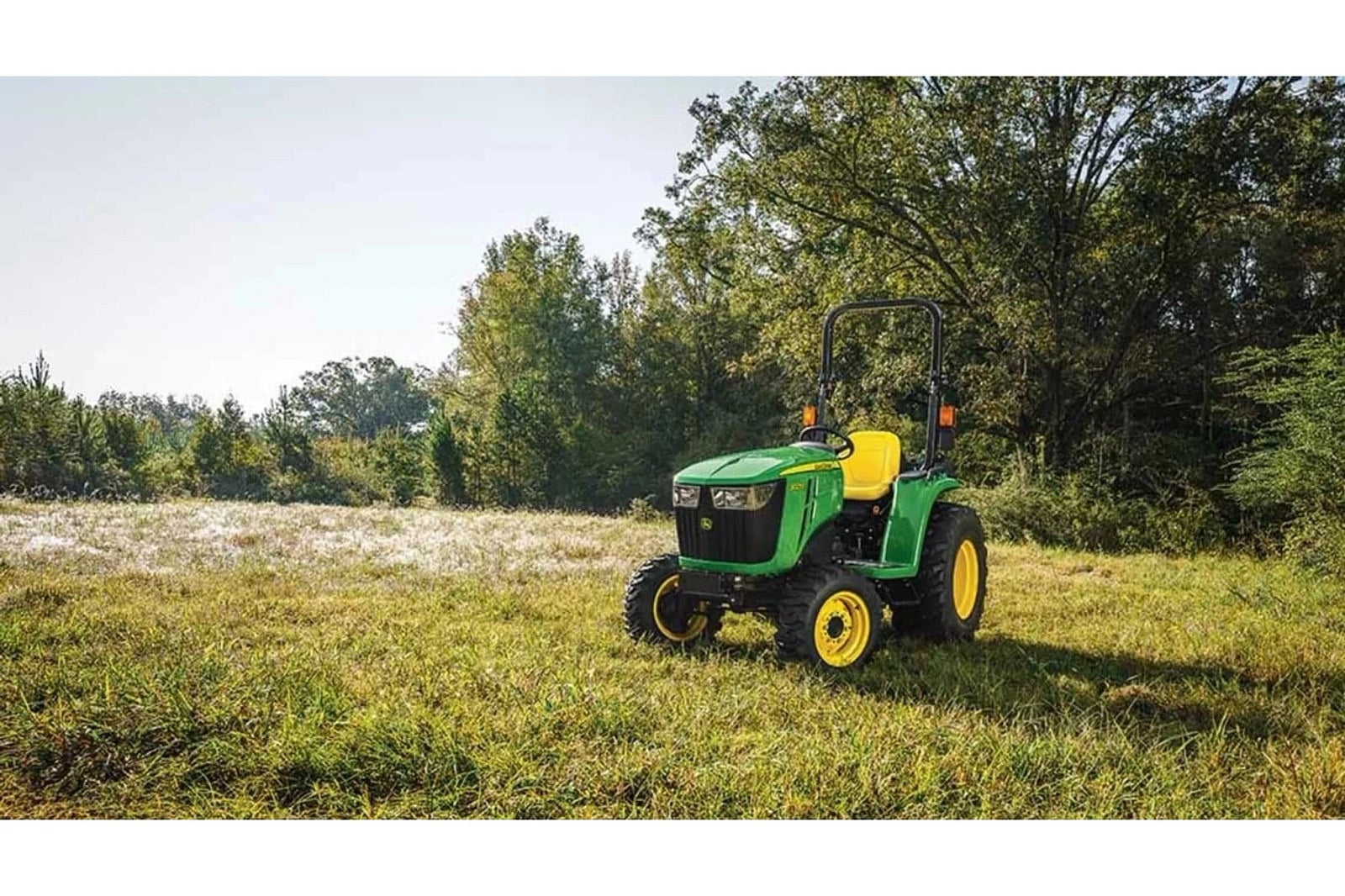A John Deere 3025E in a field