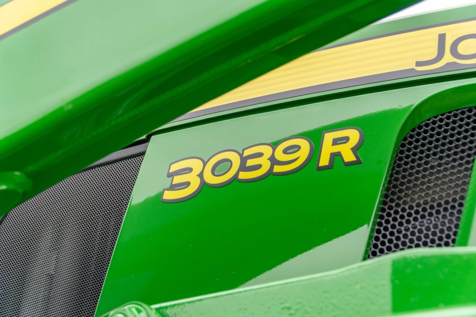 3039R badge on a John Deere compact tractor