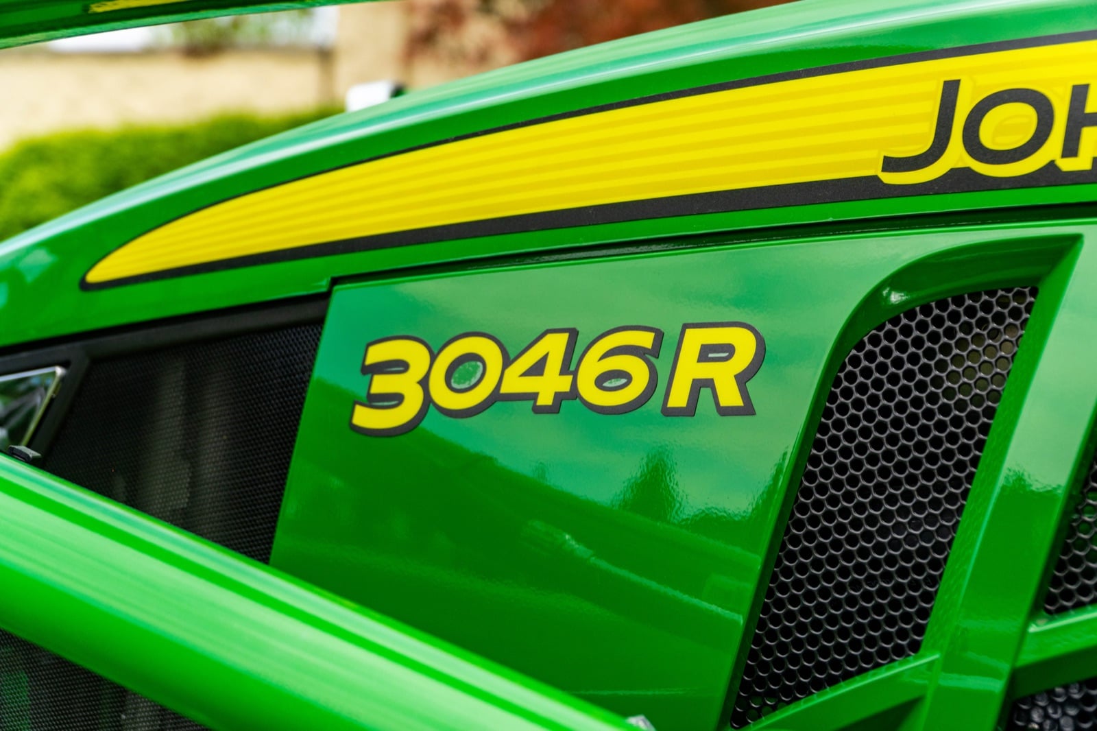 3046R badge on a John Deere compact tractor