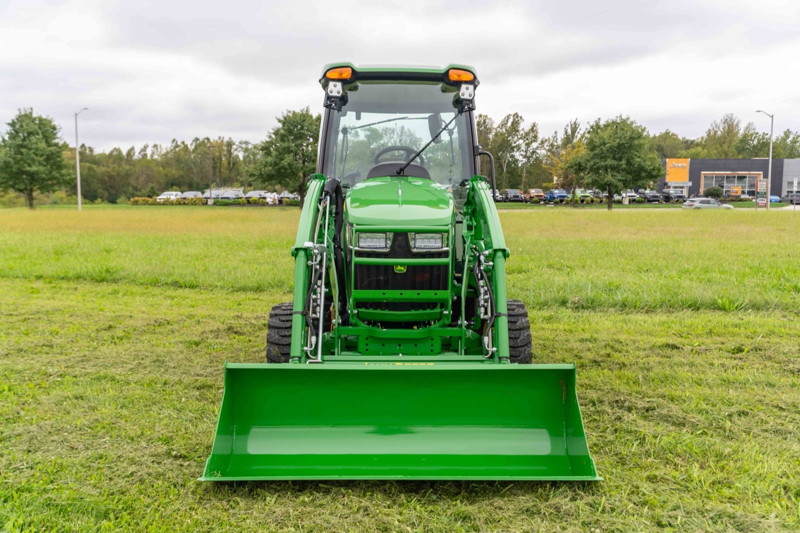Front view of a John Deere 3039R with a loader