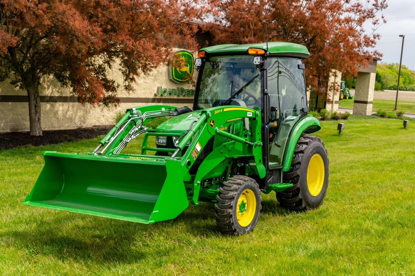 John Deere 3046R cab tractor with a loader