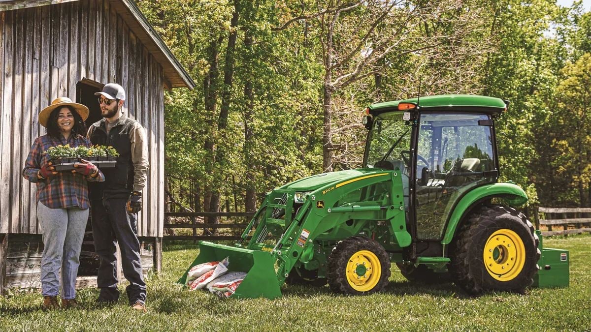 A John Deere 3 Family cab tractor on a farm