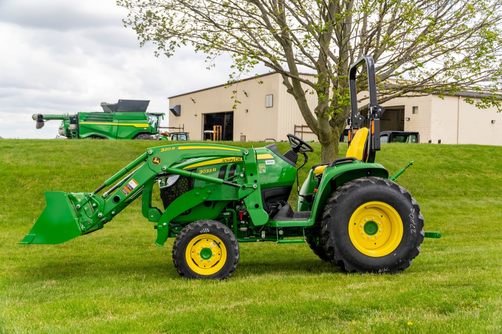 John Deere 3033R open station with a 320R loader