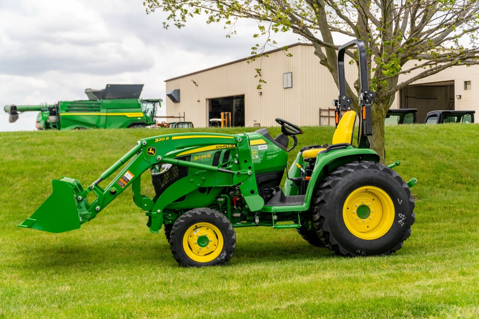 John Deere 3039R open station with a 320R loader