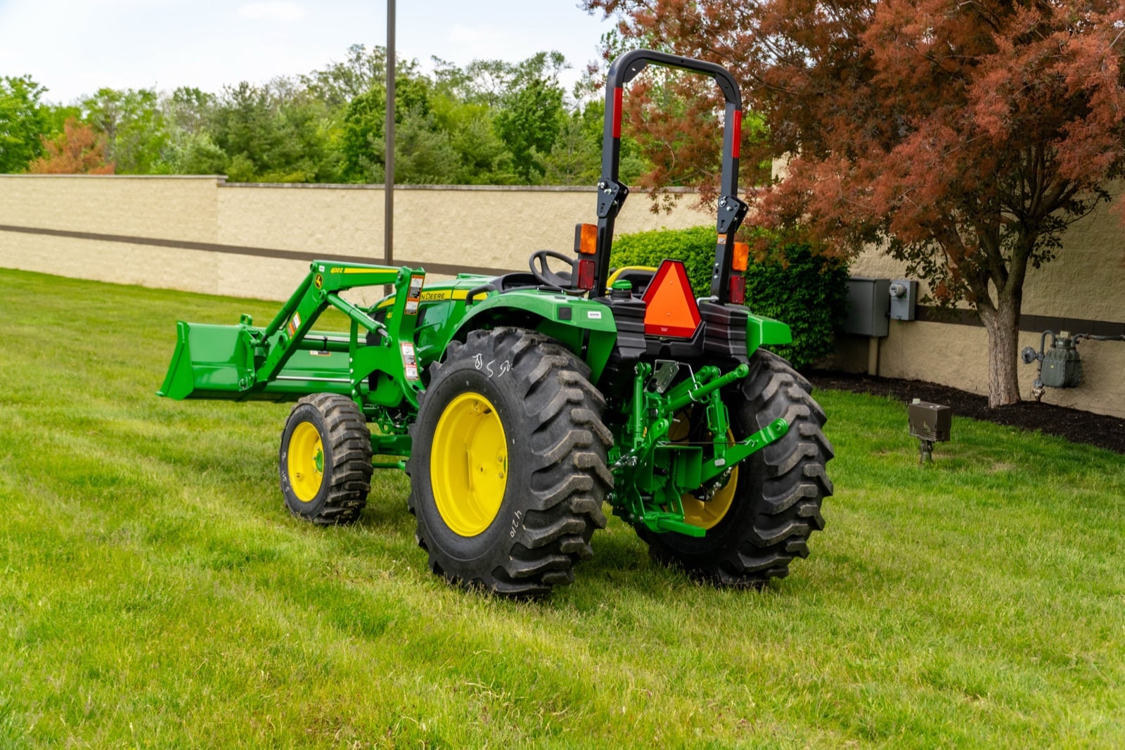 John Deere 4044M, rear three-quarter view