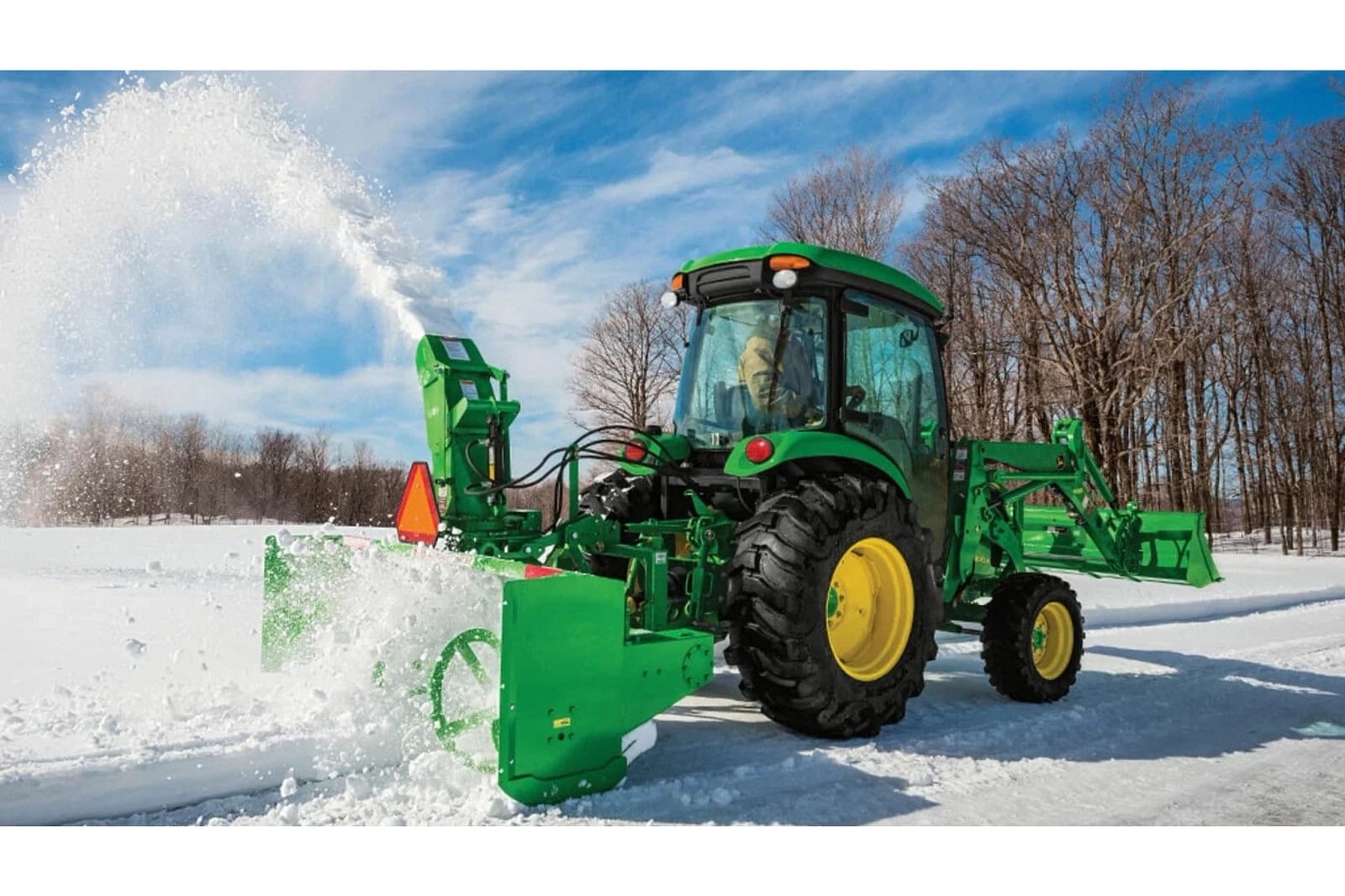 A John Deere 4052R clearing snow