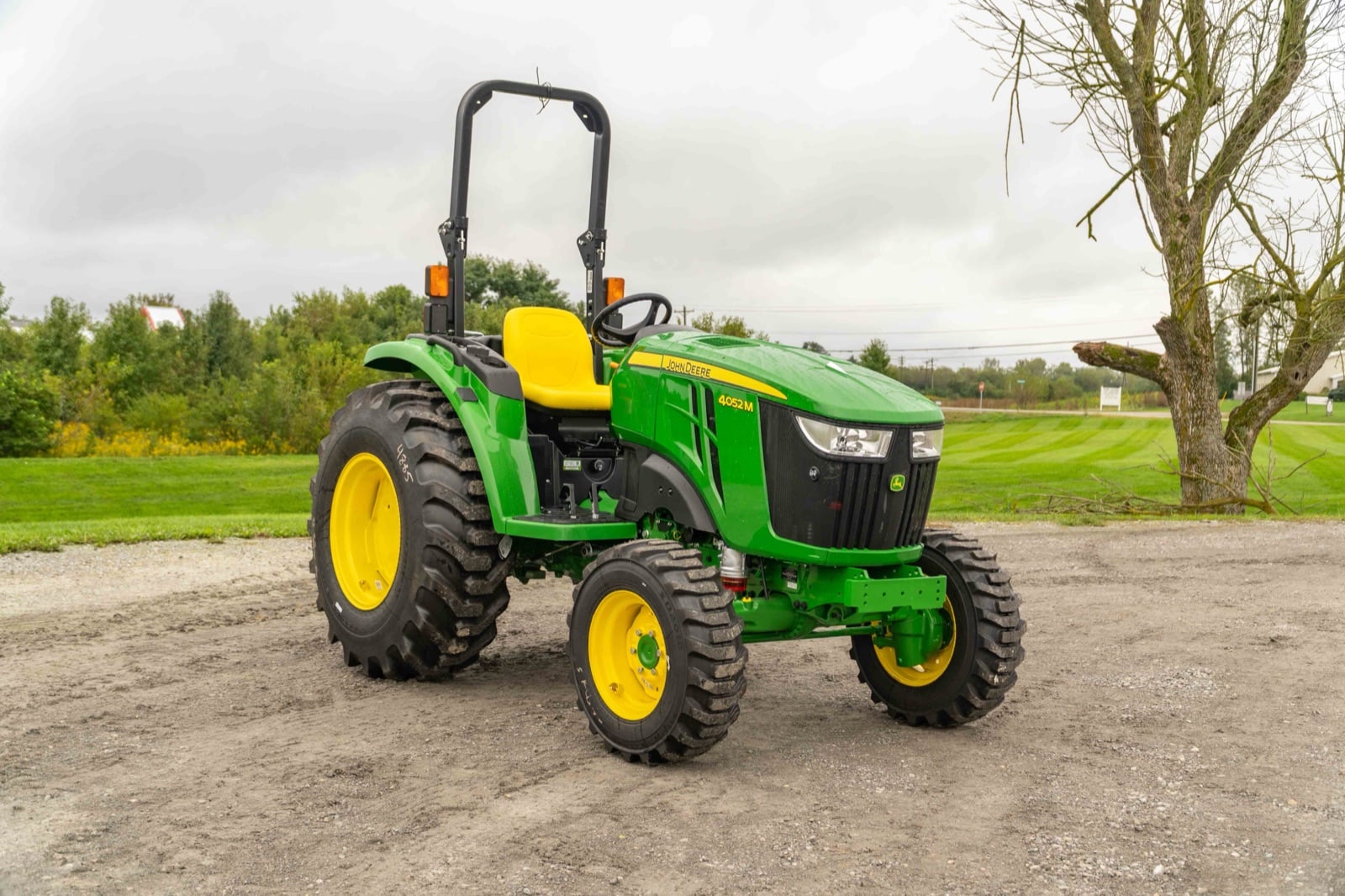 John Deere 4052M on a gravel lot