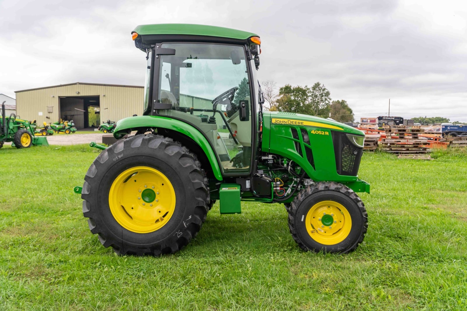 John Deere 4052R cab tractor on a dealership lot