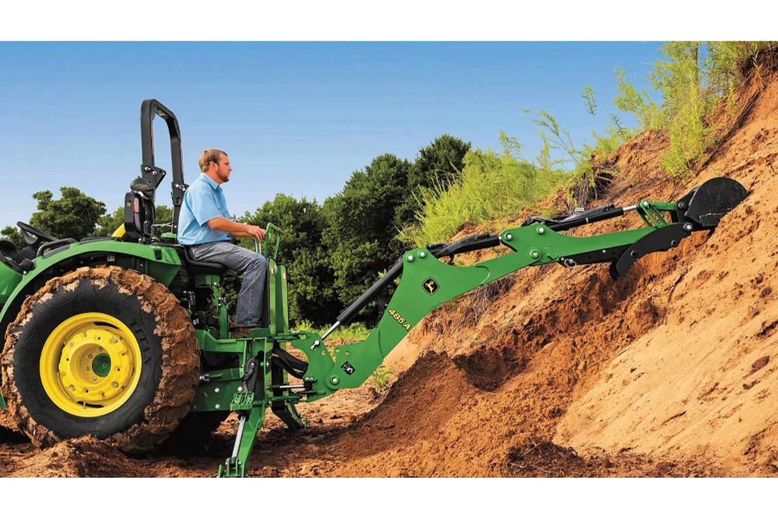 A John Deere 4044R digging with a backhoe
