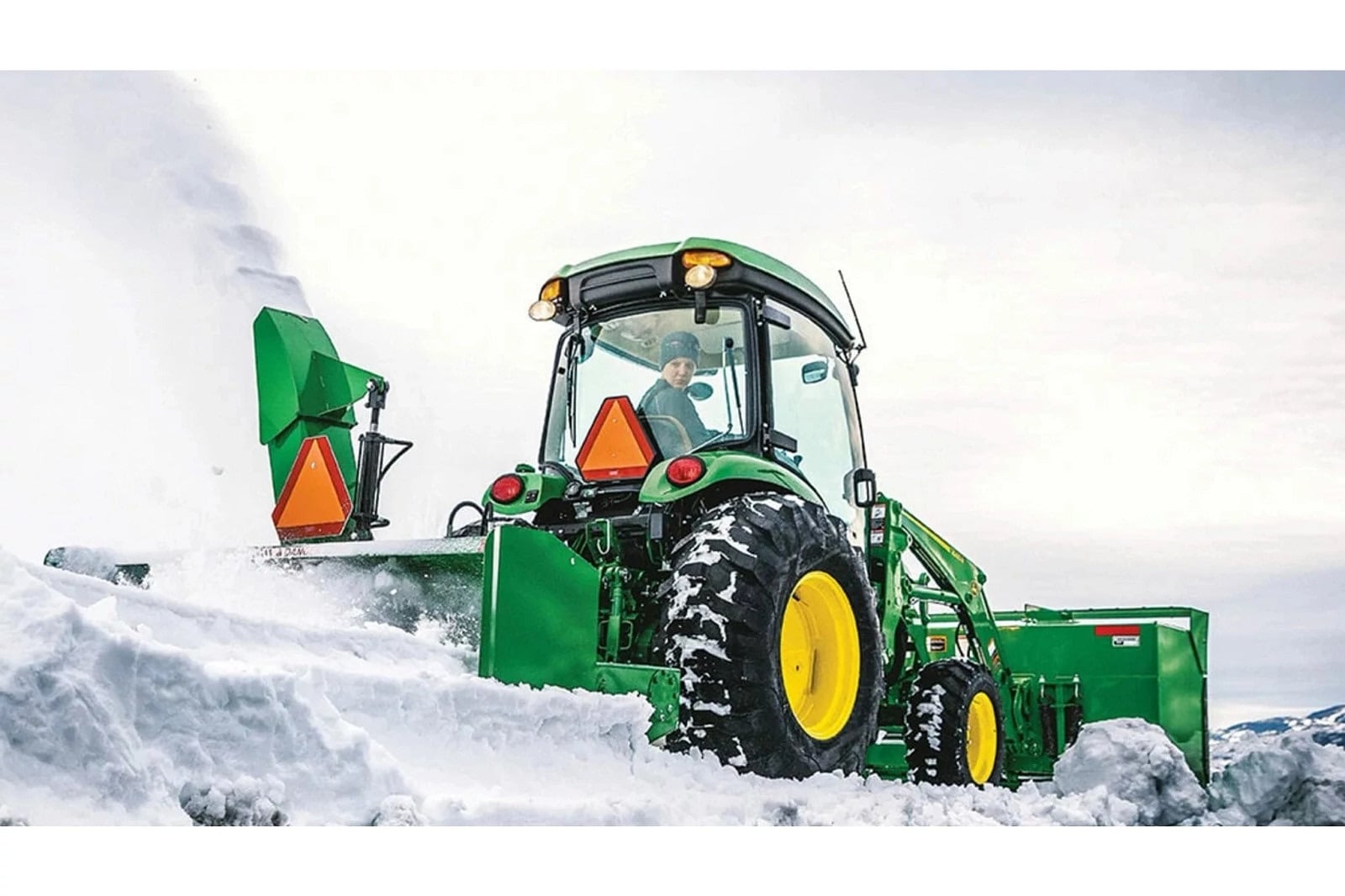 A John Deere 4066R clearing snow
