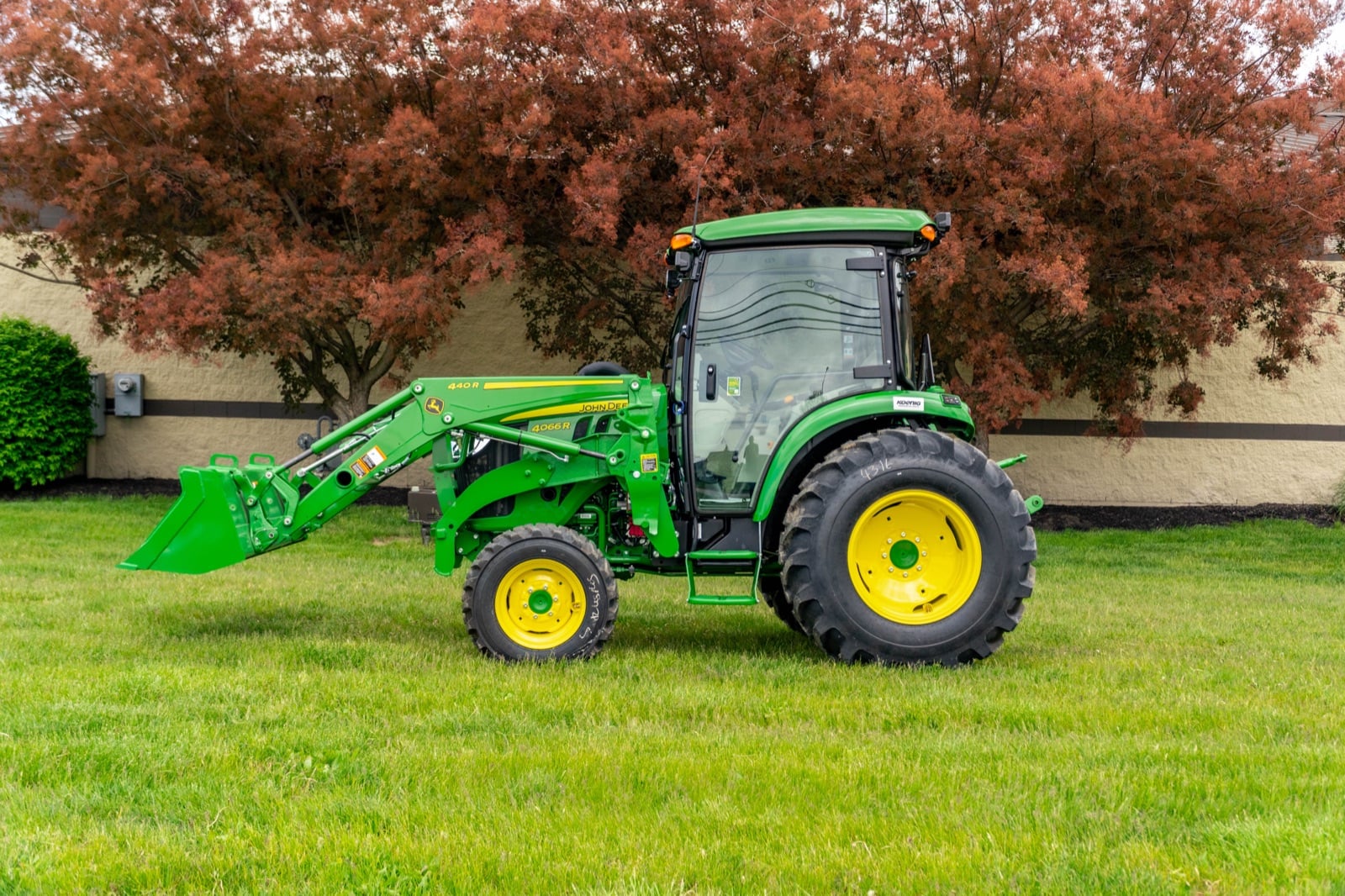 John Deere 4R Series tractor with a deluxe cab and 440R loader (4066R shown)