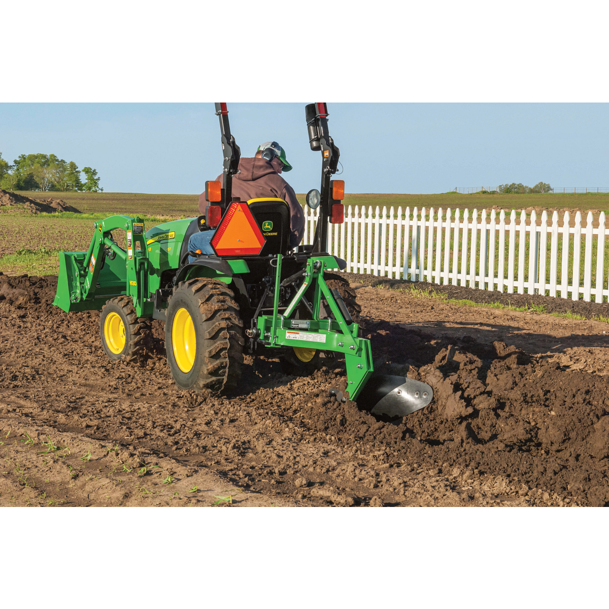 2025R Compact Tractor Digging Trench With Plow