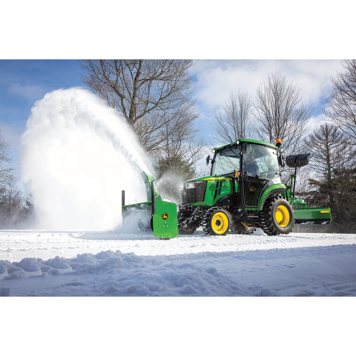 2038R Tractor Blowing Snow Off a Driveway